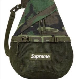 This is an Authentic Brand New Woodland Camo Supreme Sling Bag.